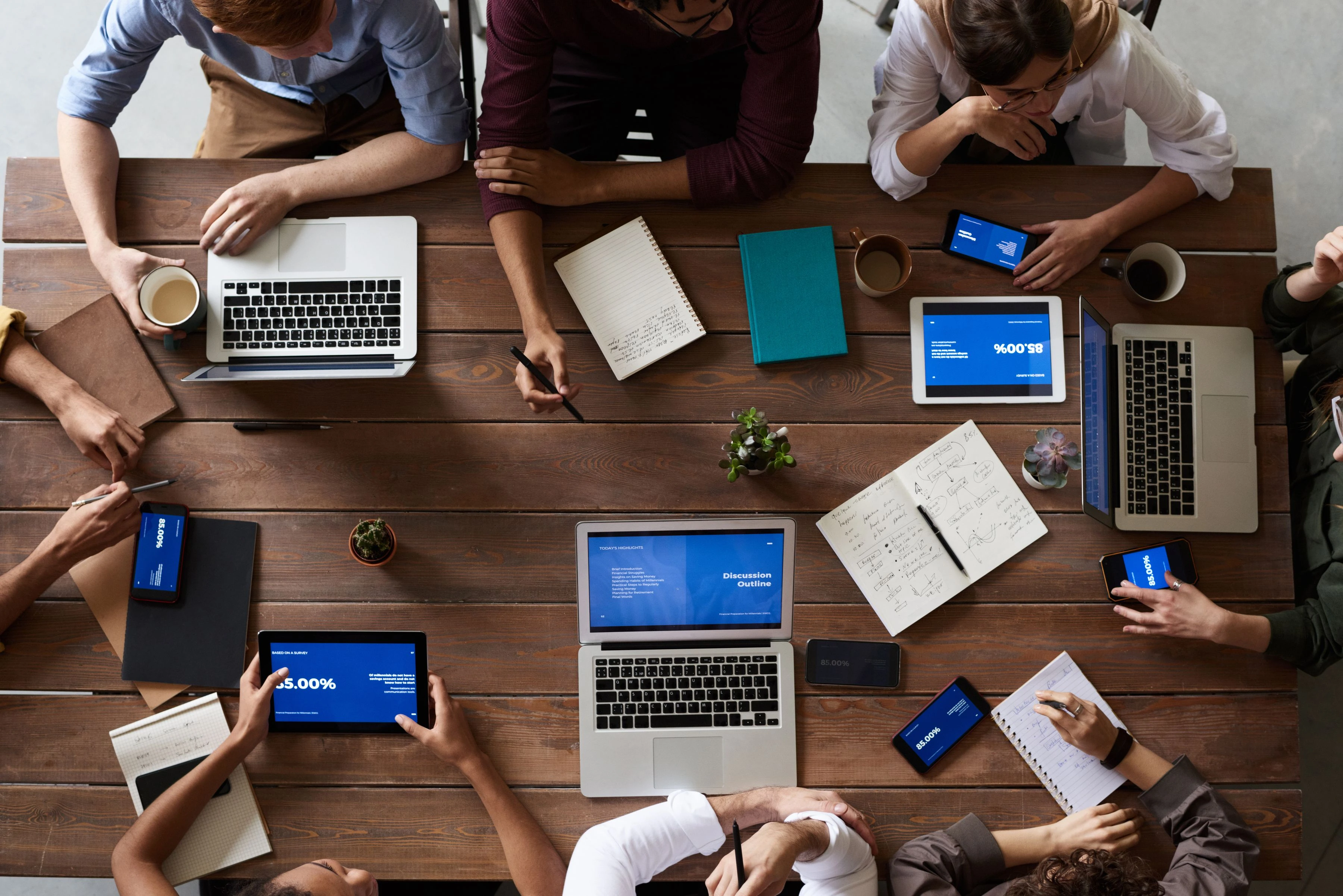 Business team reviewing financial documents around a meeting table